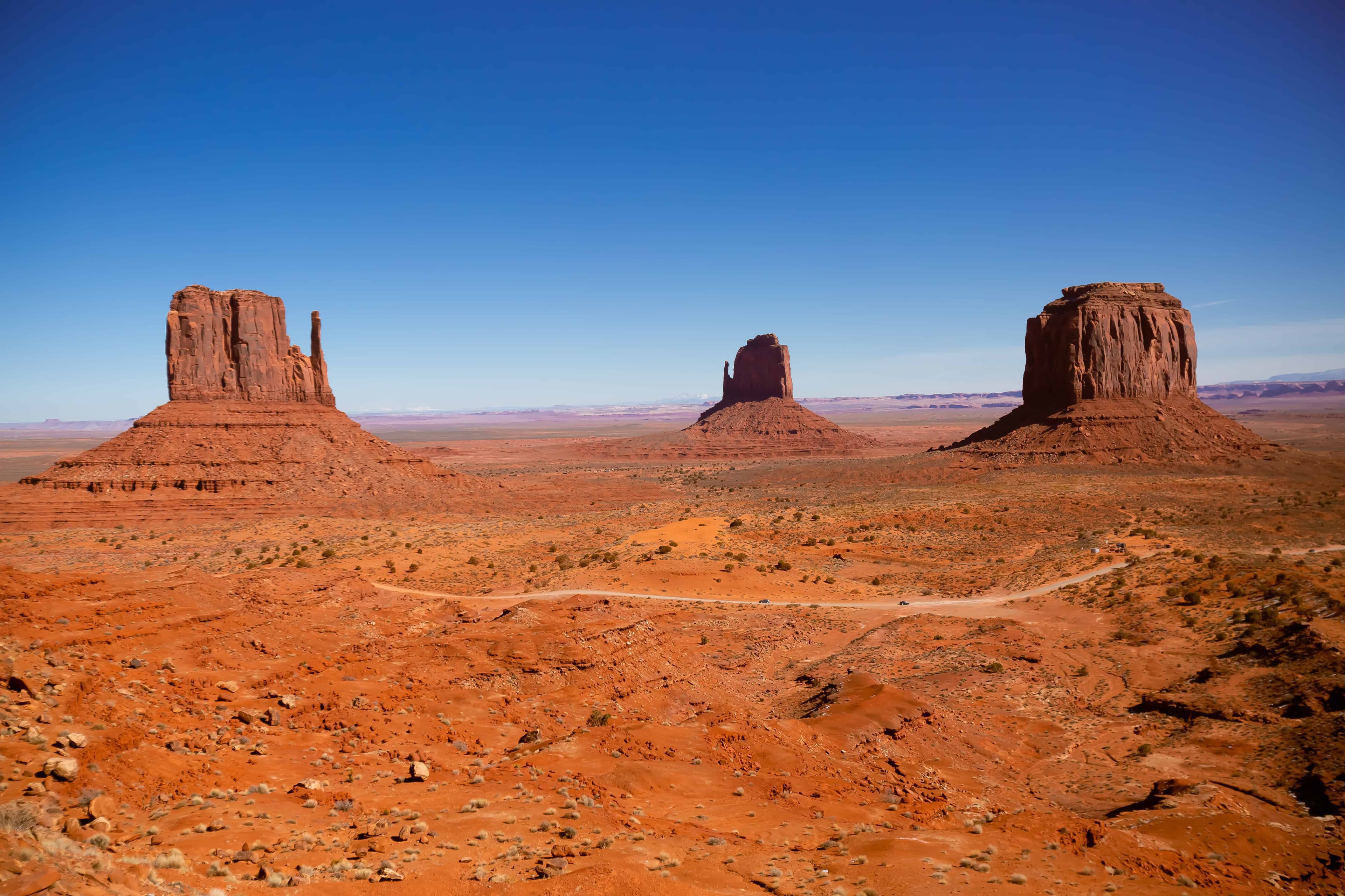 Monument Valley Mitten Buttes at sunset, view from visitor center area